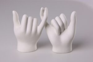 human hand forming heart shape hand casting