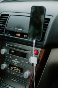 a car radio with a red button auto adapter